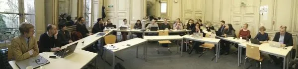 people sitting around a table for a workshop